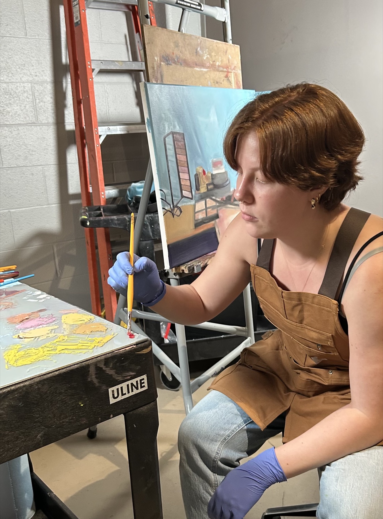 Kiley Honsinger painting in her studio